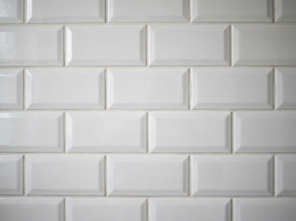 Ceramic metro tiles on a bathroom wall
