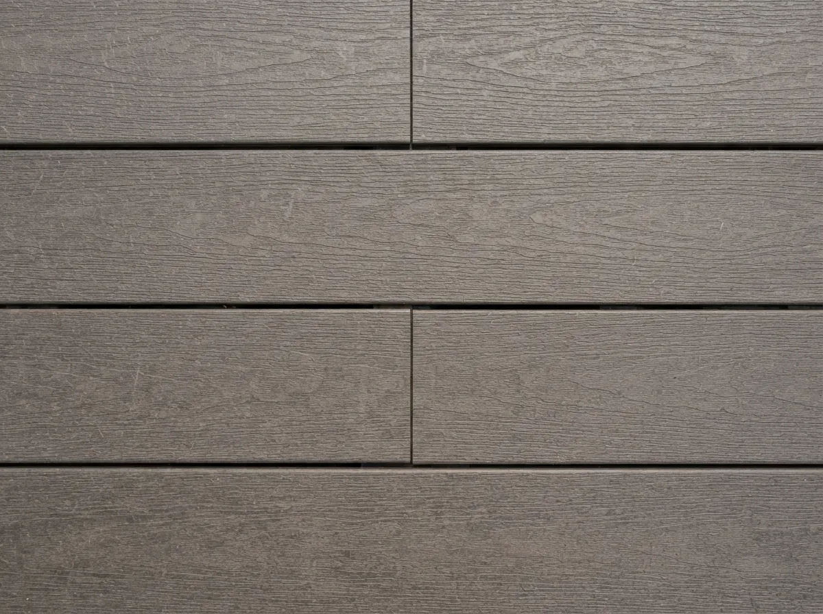 Modern grey composite decking with a realistic wood grain finish and hidden fixings