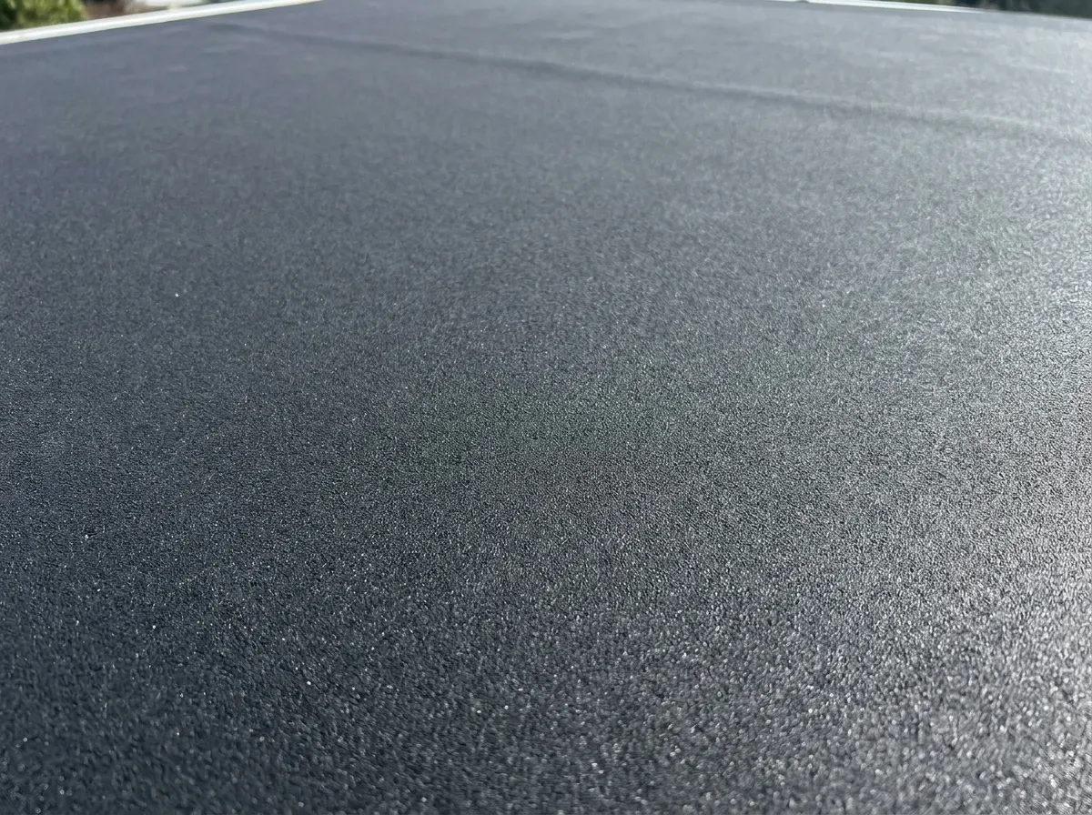 Seamless EPDM rubber flat roof installation on an extension