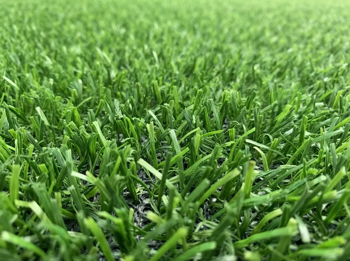 Dog sitting happily on permeable pet-friendly artificial grass