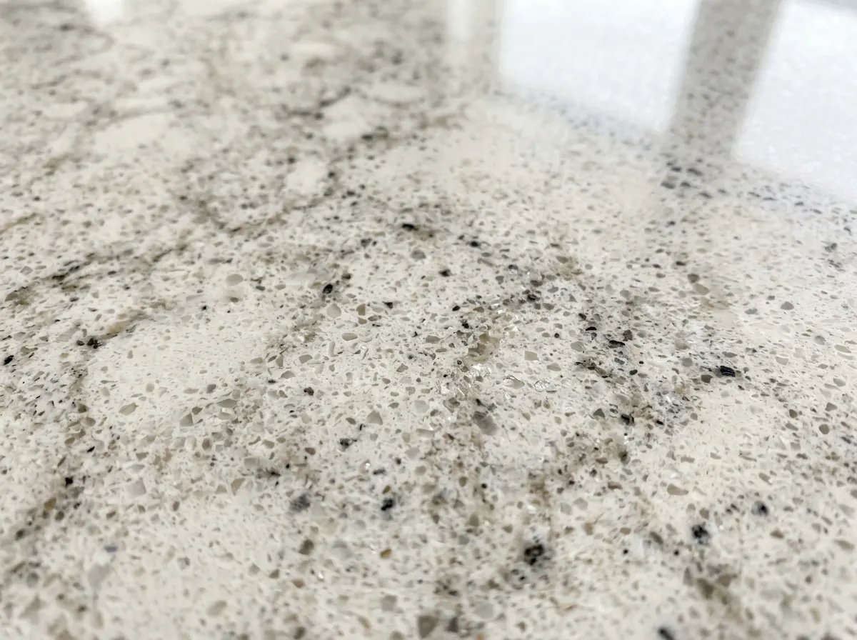 White quartz worktop with subtle grey marble veining in a modern kitchen