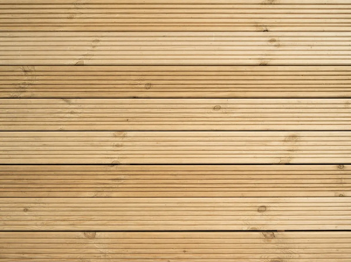 Pressure treated grooved softwood pine decking boards installed in a garden